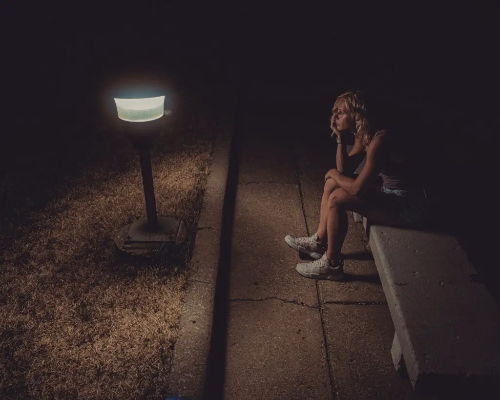 Girl sitting alone on the bench