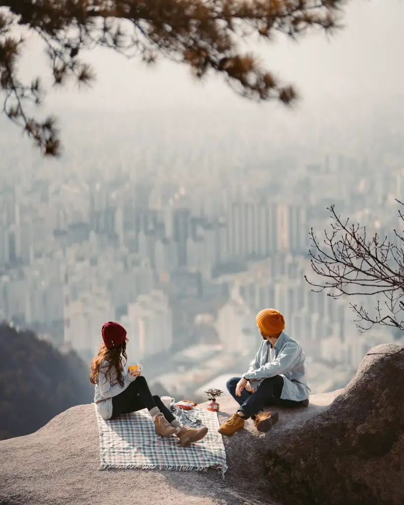 Couple dating on a cliff