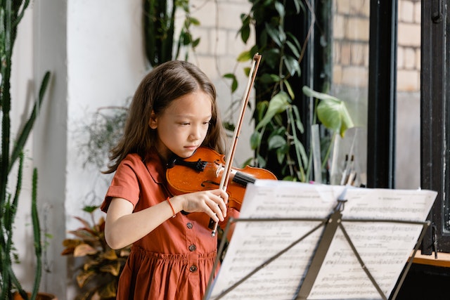 Violin improves co-odination of body parts in child