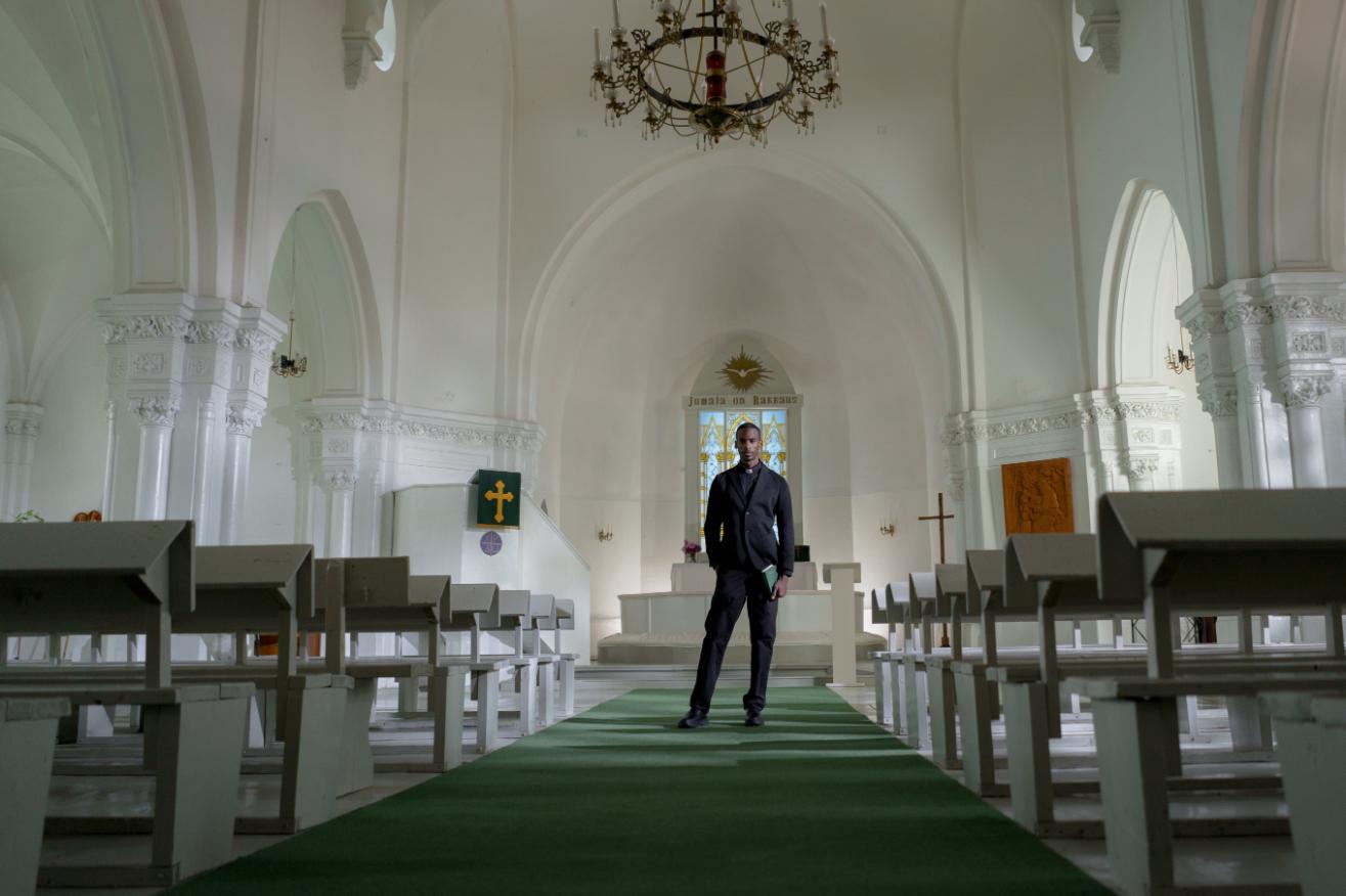 A Christian Person Standing in His Church for Pray