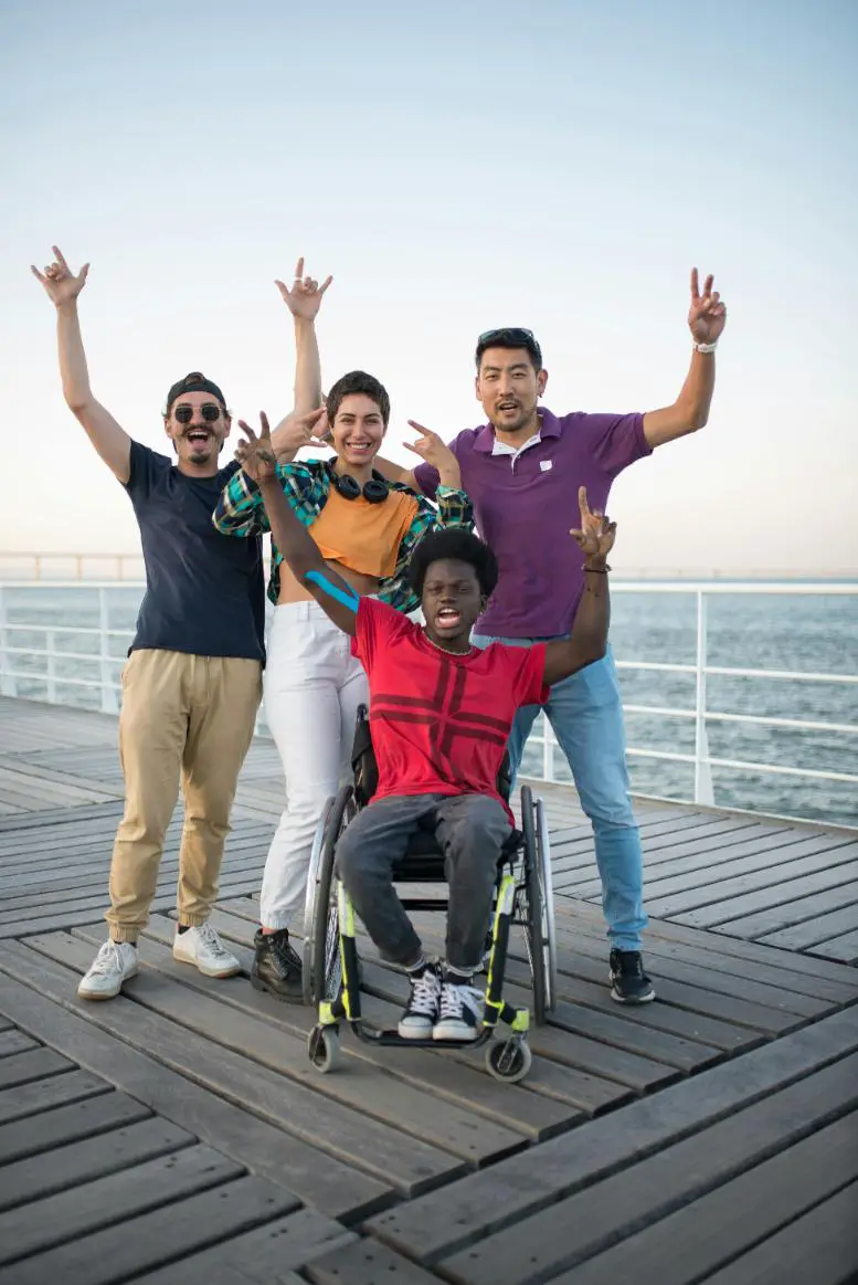 A disabled person having a good time with his friends