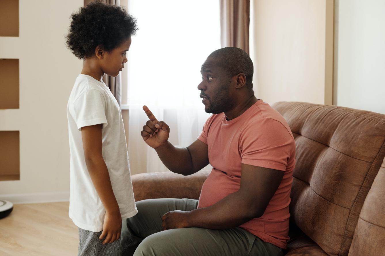 Parent counselling the child about anger management