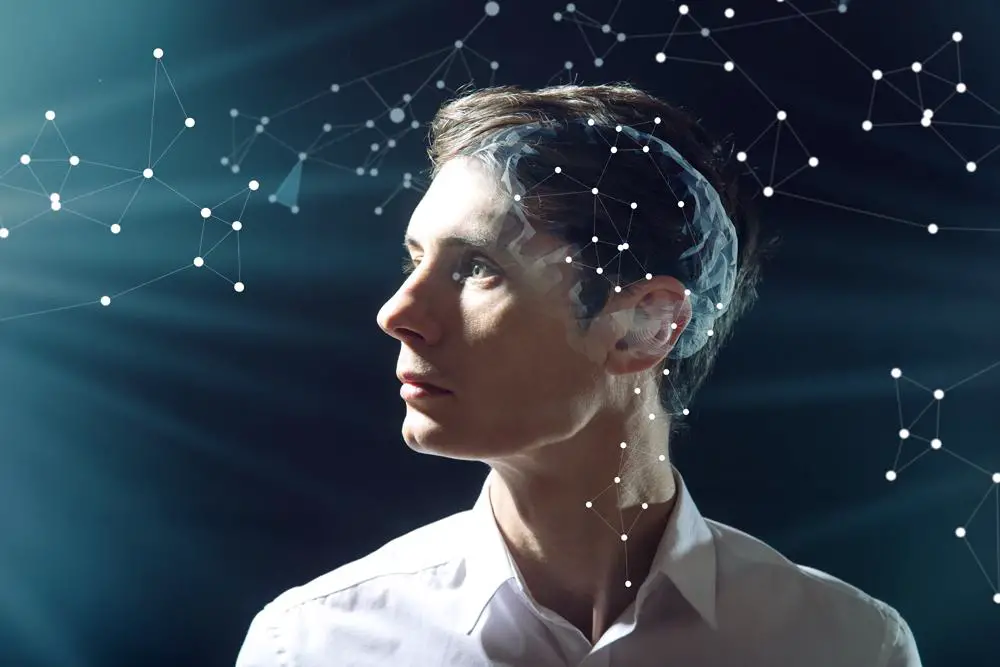 A person against dark background with visual representation of his anxious mind