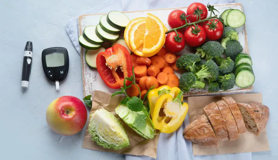 Various carbs containing fruits vegetables and other food items placed together