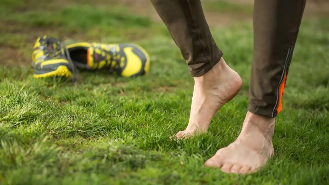 A man barefooted on ground
