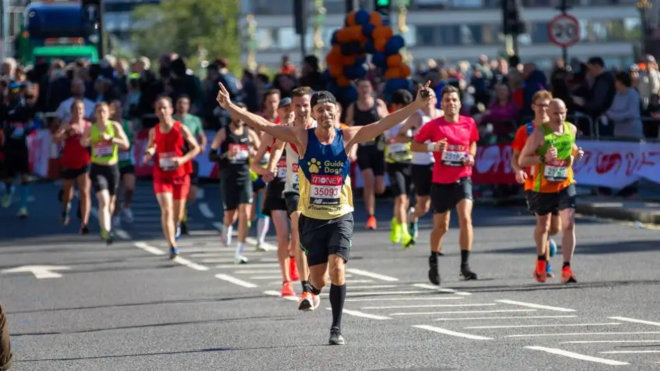 People running and winning marathon race