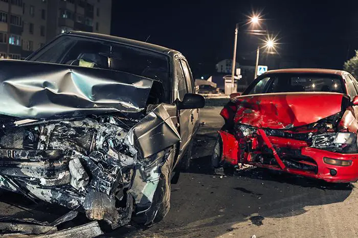 Two crashed cars on a road