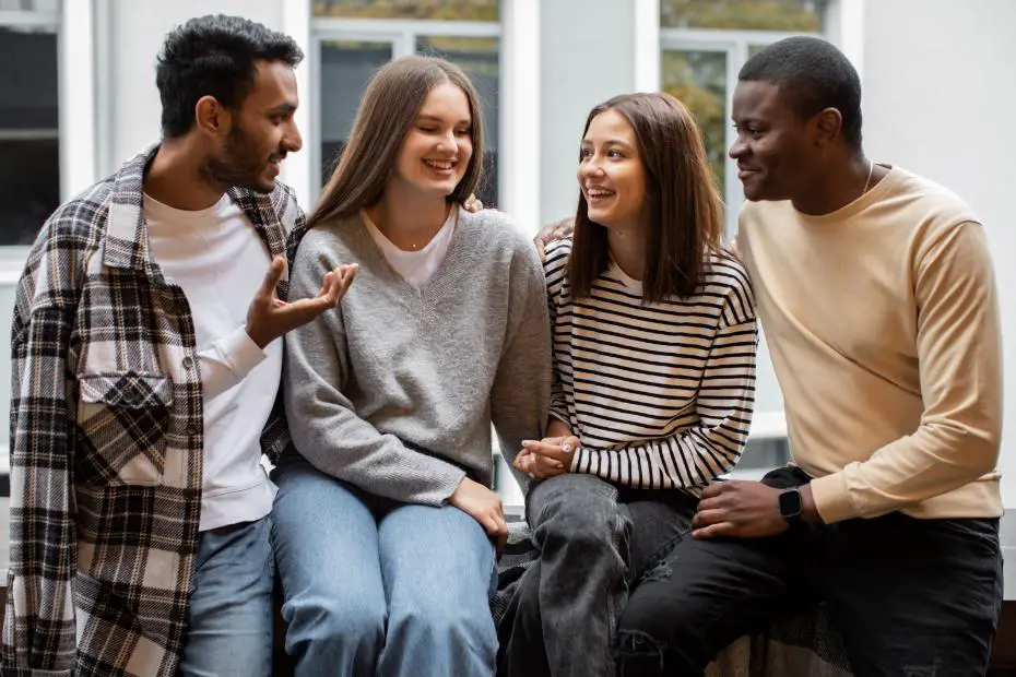 A group of 4 friends sitting together and having a great time with each others