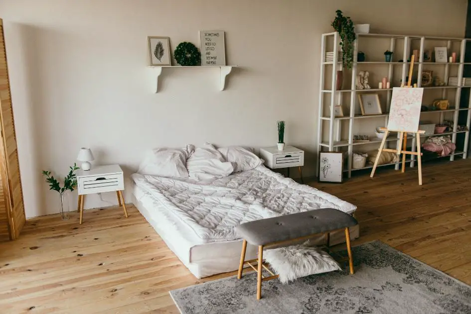 A clean room showing a floor bed with good space