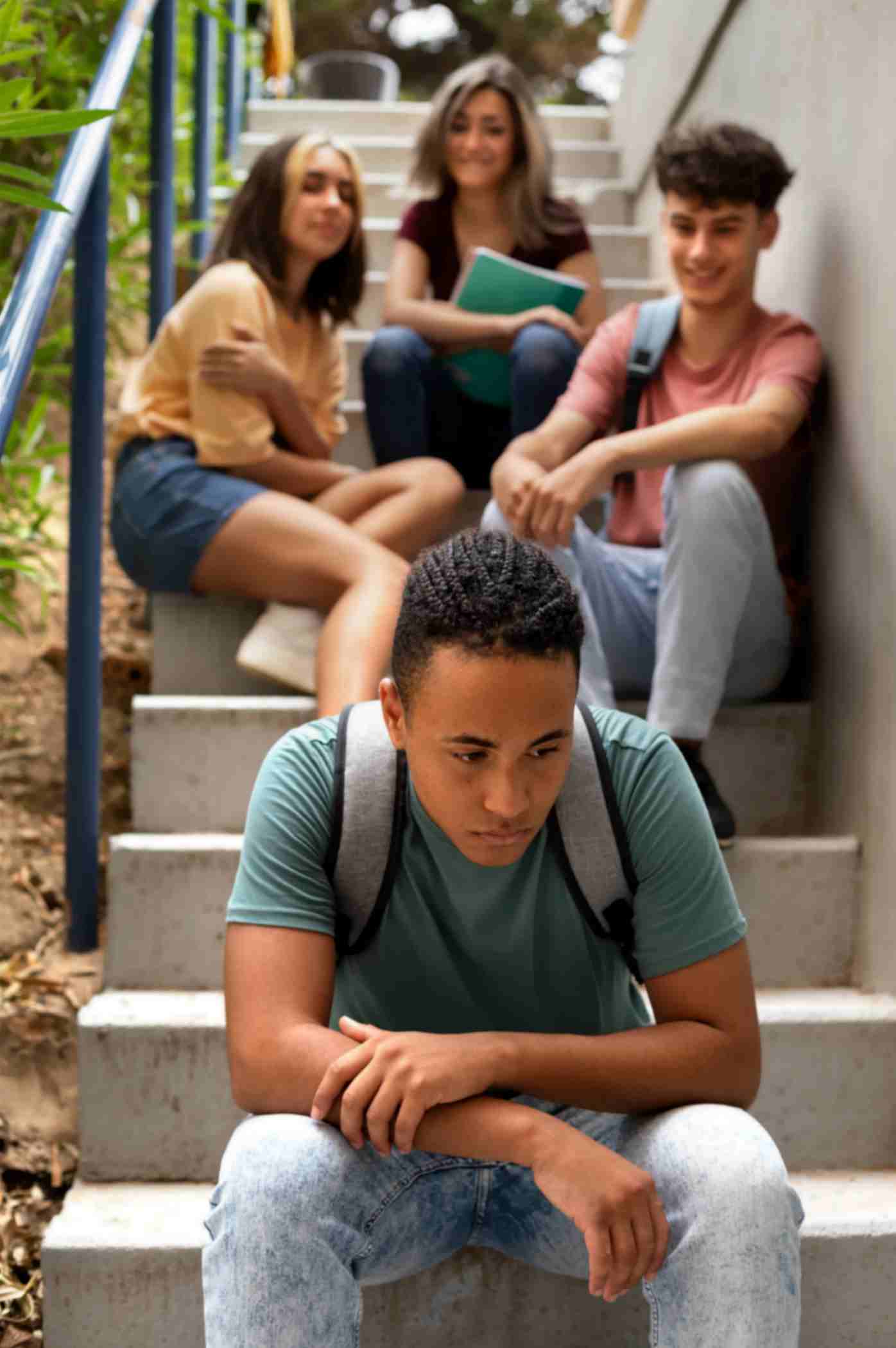 Boy is sitting far away due to stigma