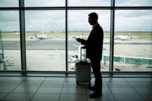 Businessman on Airport with Luggage