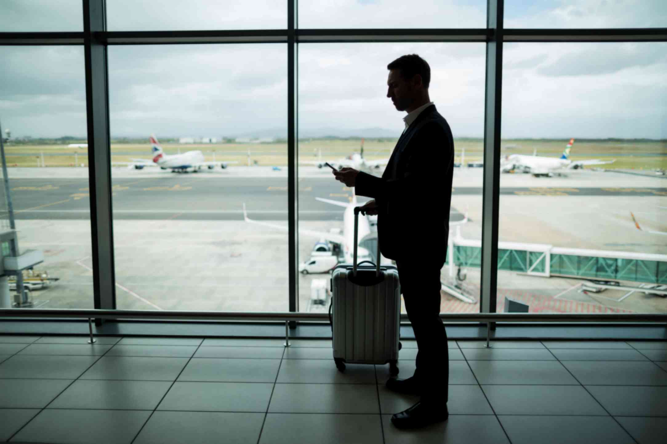 Businessman on Airport with Luggage