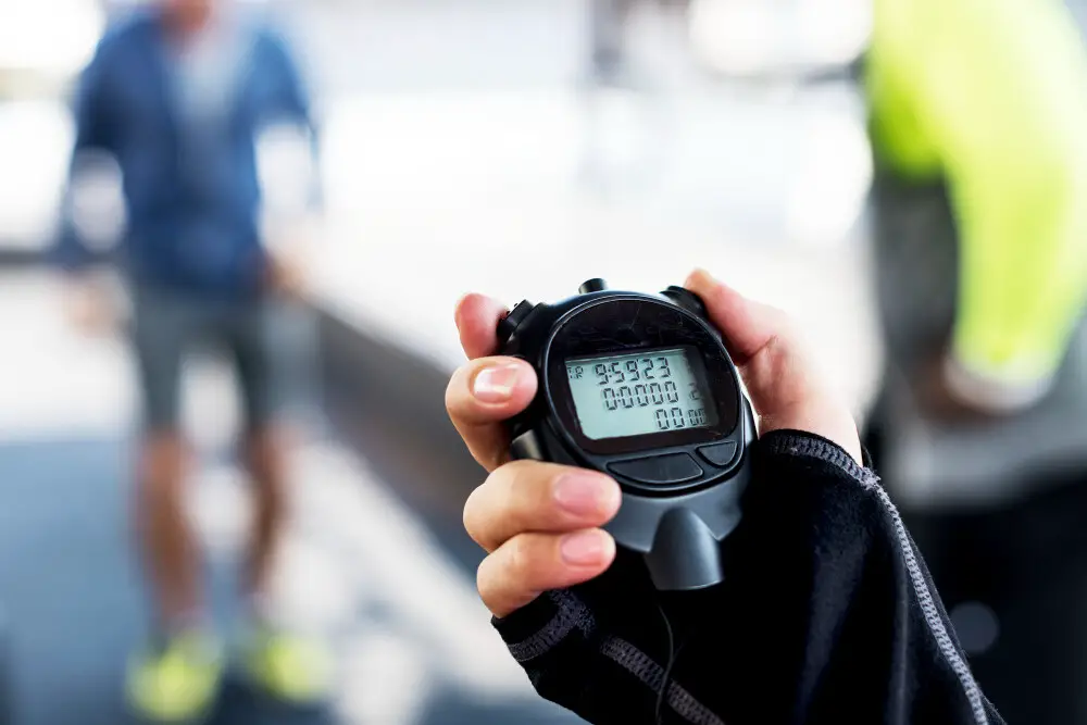 Closeup hand holding stopwatch 