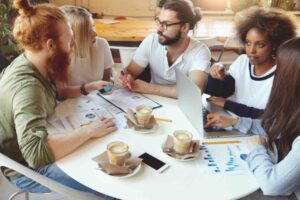 Group of Individuals having discssion over Coffee