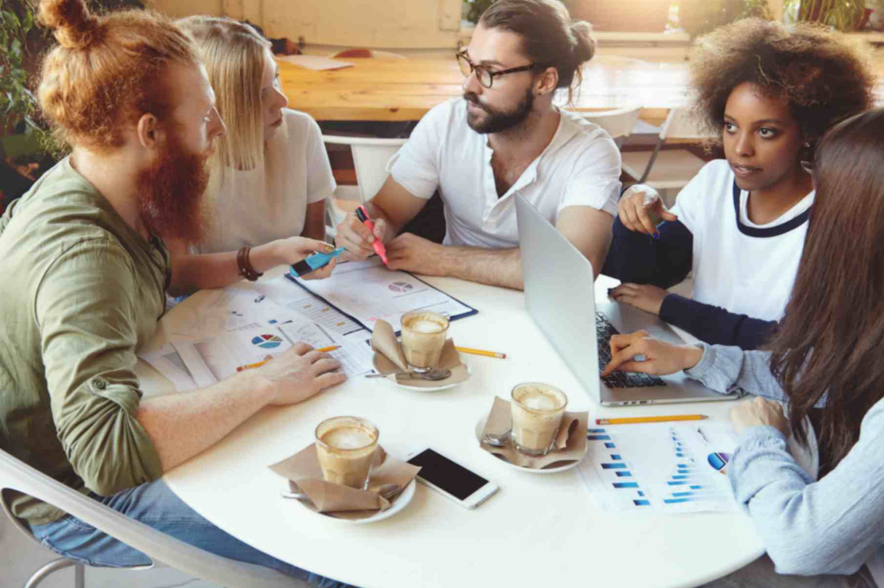 Group of Individuals having discssion over Coffee