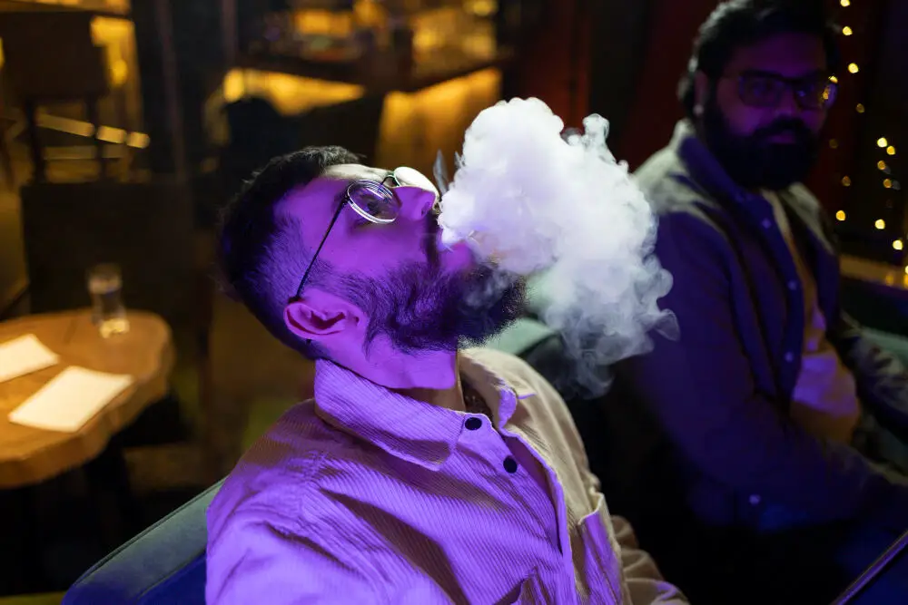 Young Man Relaxing by Vaping