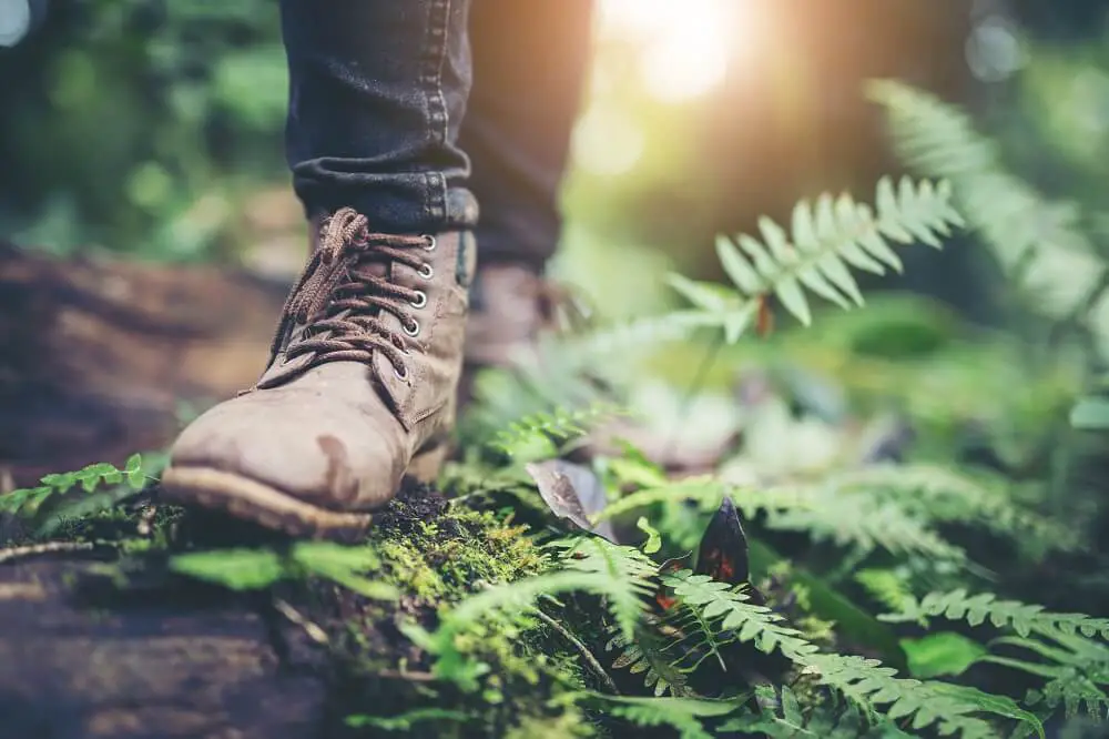 A shoe feet walking on a ground of green