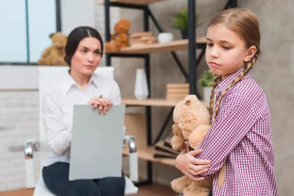 An Unhappy Child with Teddy Bear and a Working Mother Dealing with Child-Care Issues