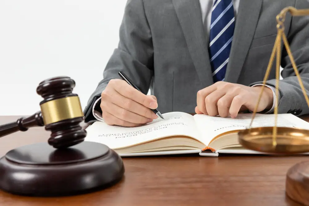 Person with Gavel and Table Close-up Shot
