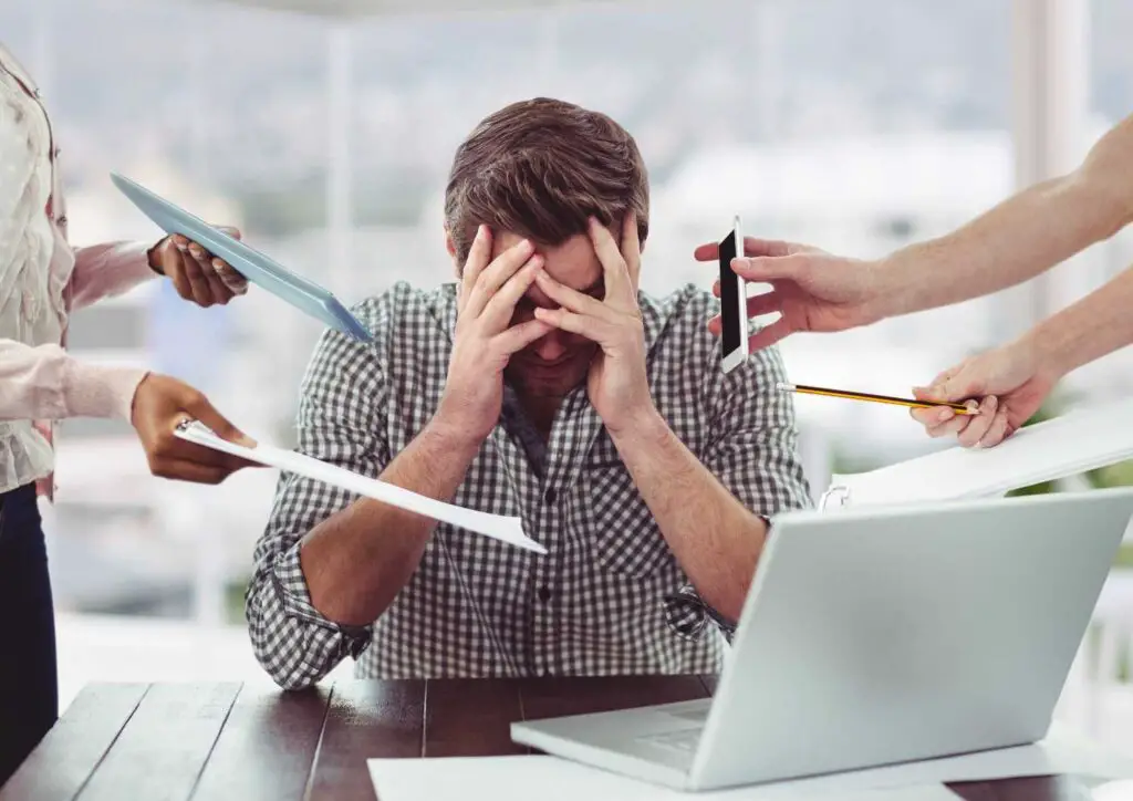 Person is going through stress due to workload 