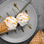 Vanilla ice cream on plate with topping