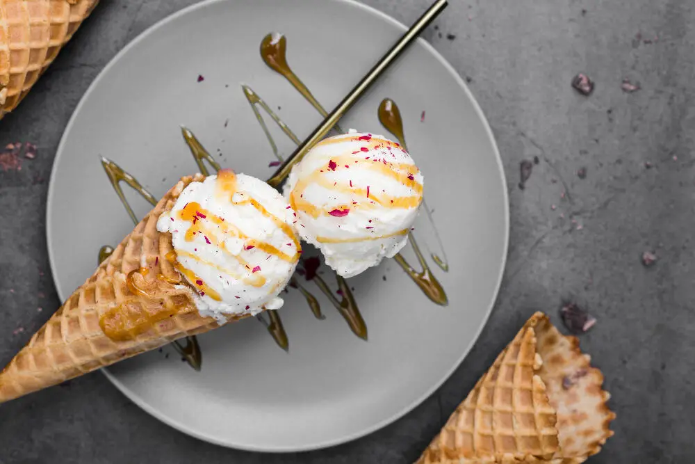 Vanilla ice cream on plate with topping