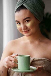 Women Rejuvnating Her Skin by Drinking Green Tea