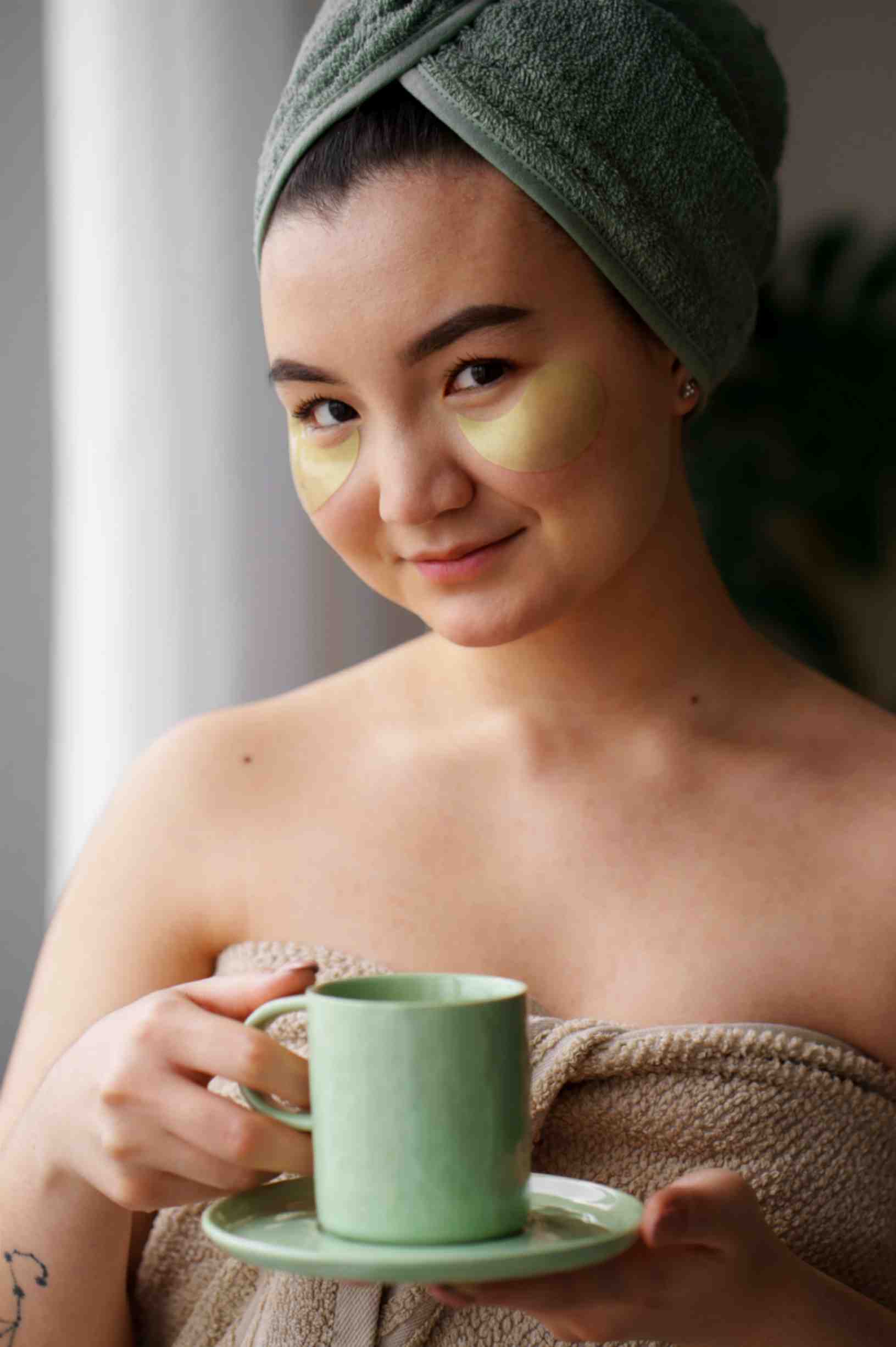 Women Rejuvnating Her Skin by Drinking Green Tea