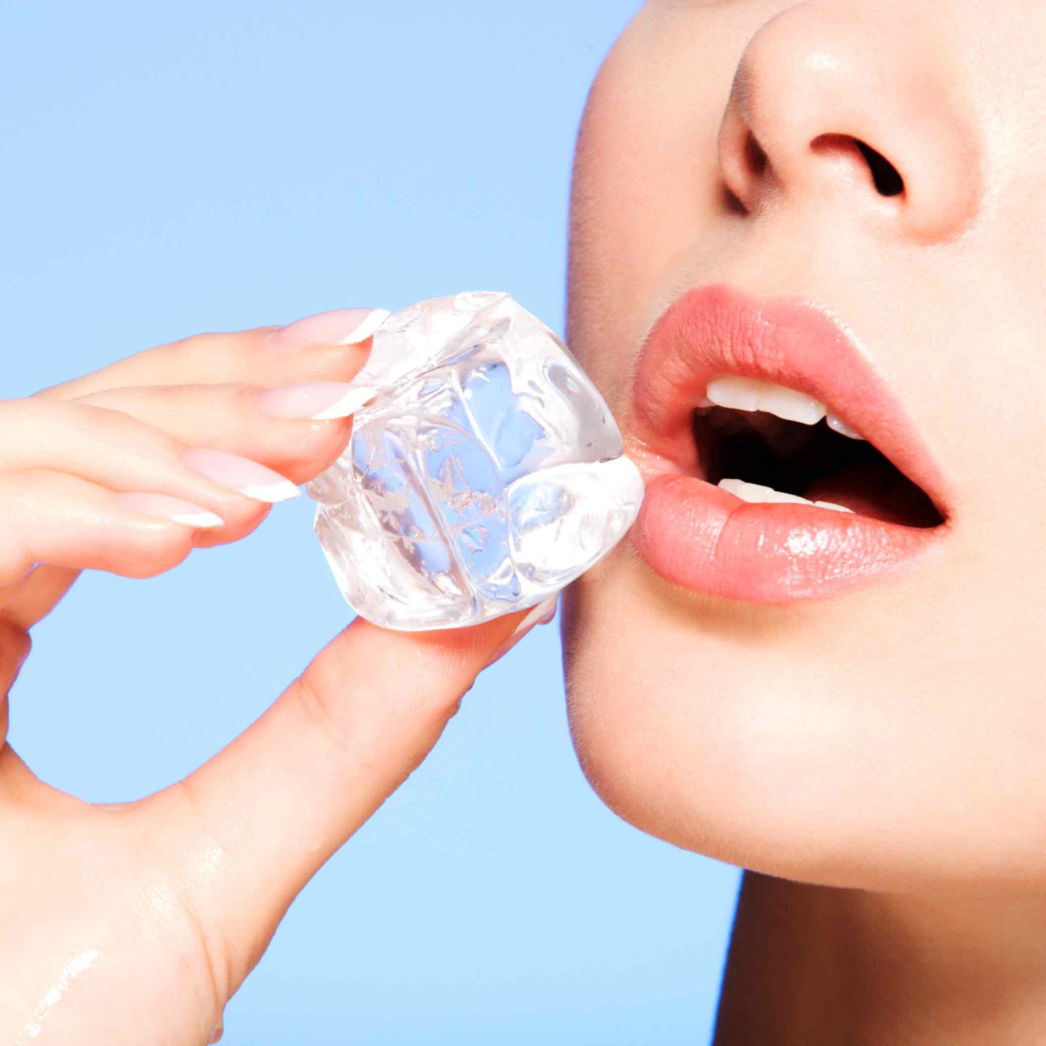A Beautiful Young Lady Eating Ice Cube