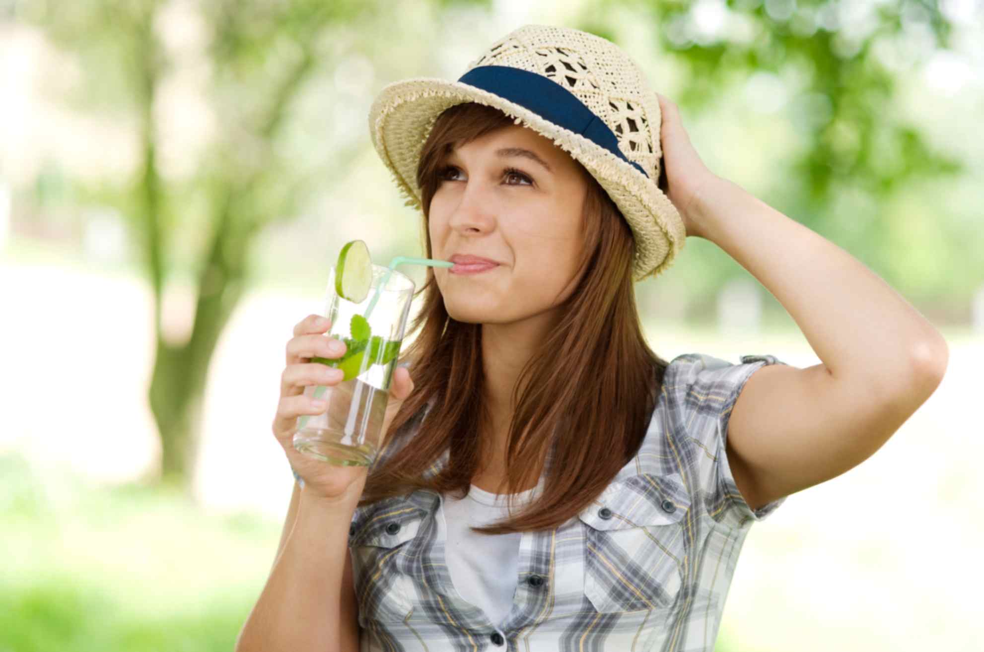 A beautiful girl drinking mint water 