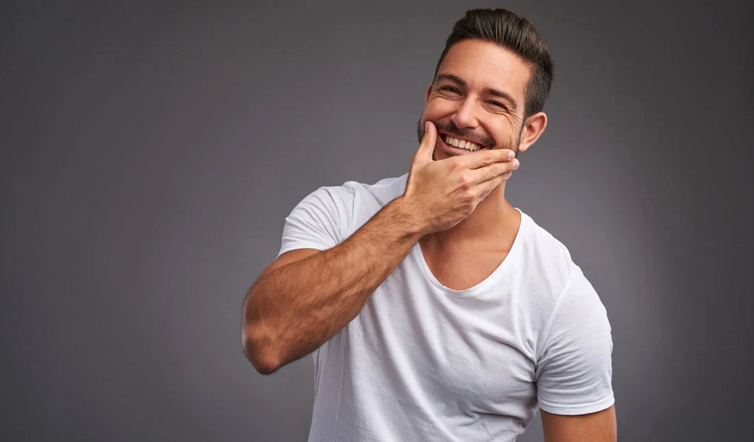 A joyful man in white t-shirt