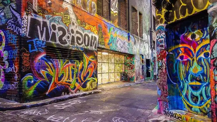 Colorful and vibrant graffiti art adorning the walls of a lively street, 
