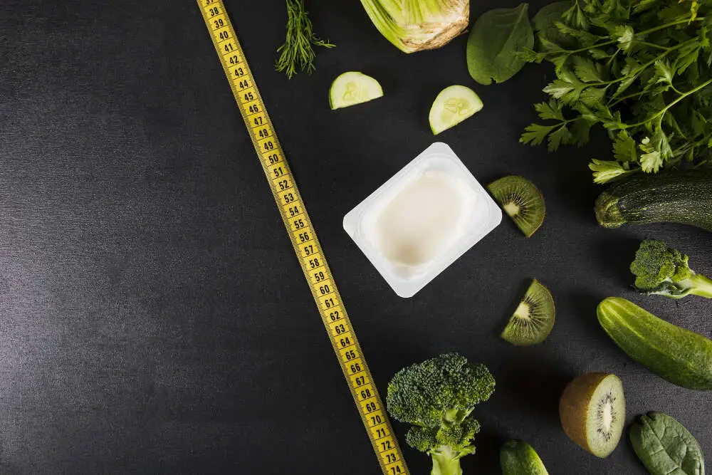 high angle view measuring tape and veggies