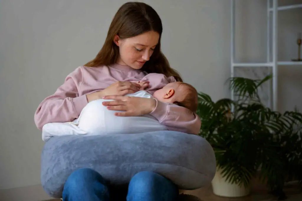Mother is breast feeding her kid 