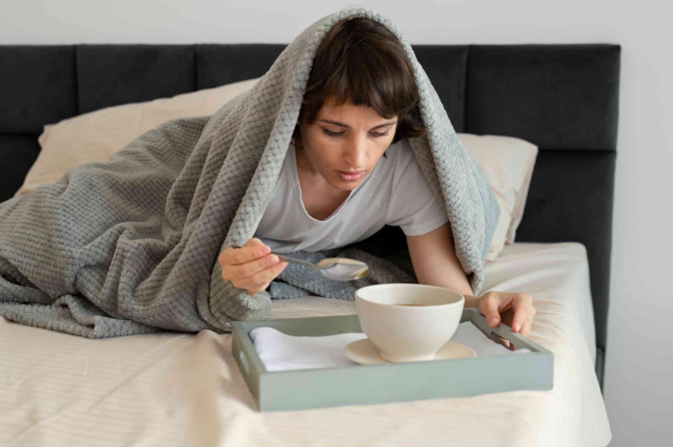 Sick Woman Lying on Bed having Soap