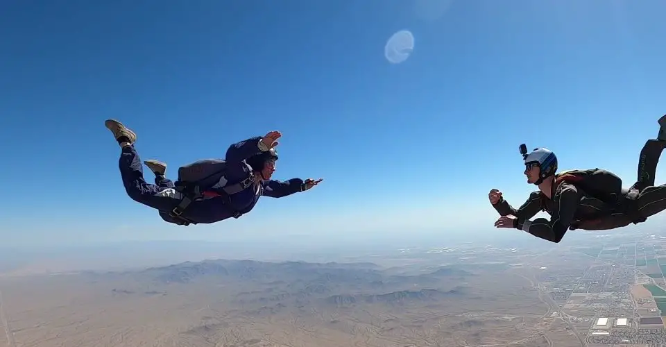 Two skydivers in the sky