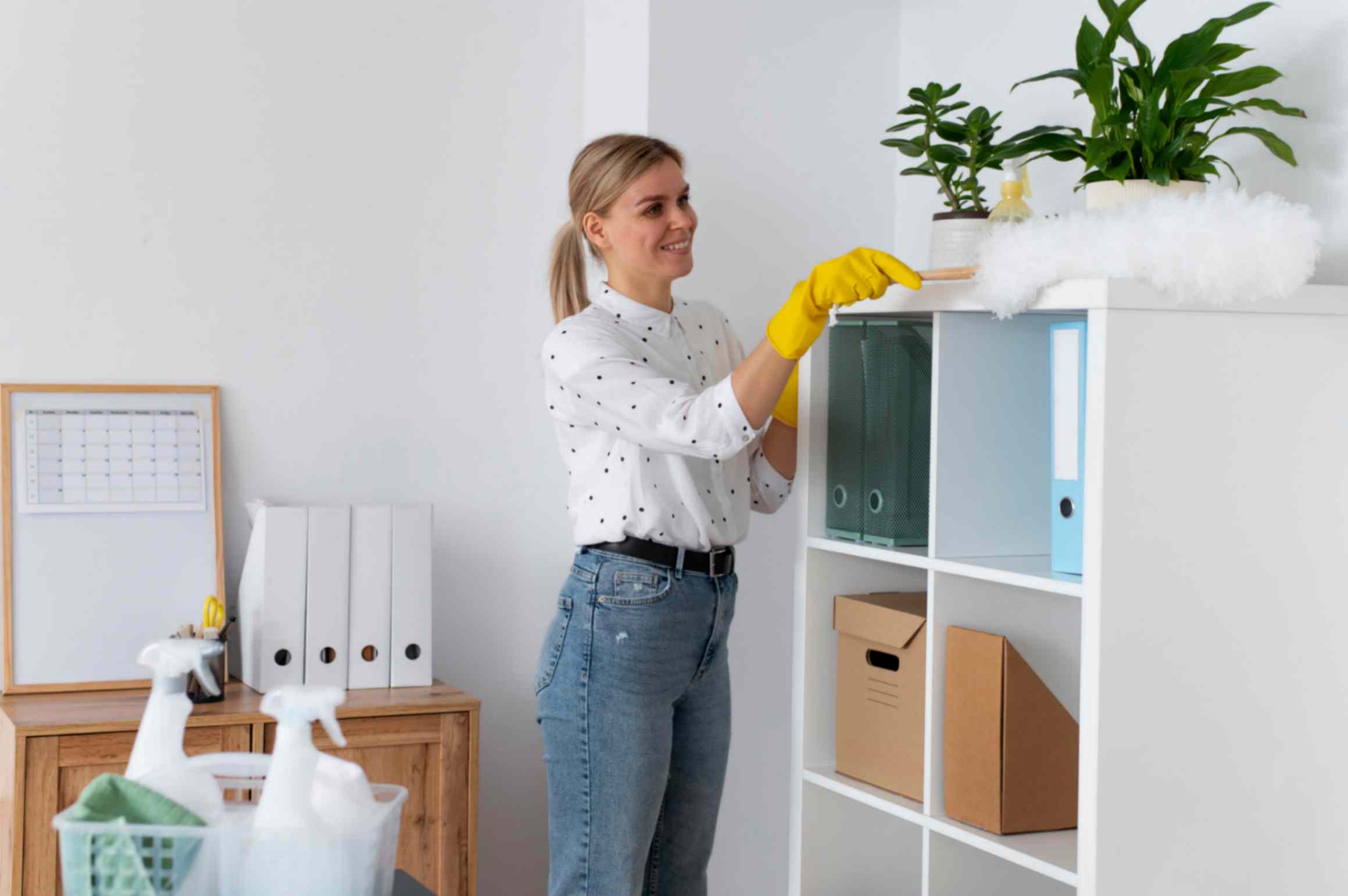 women cleaning and organizing her cupboard
