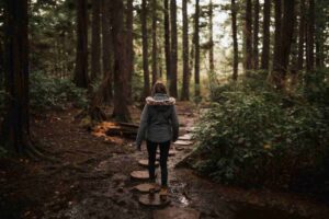 women walking through the forest