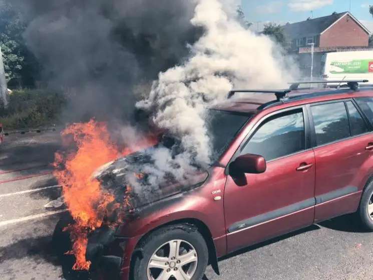 A car caught in fire on a road 
