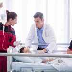 Doctor and Rescue Team Examining the Patient
