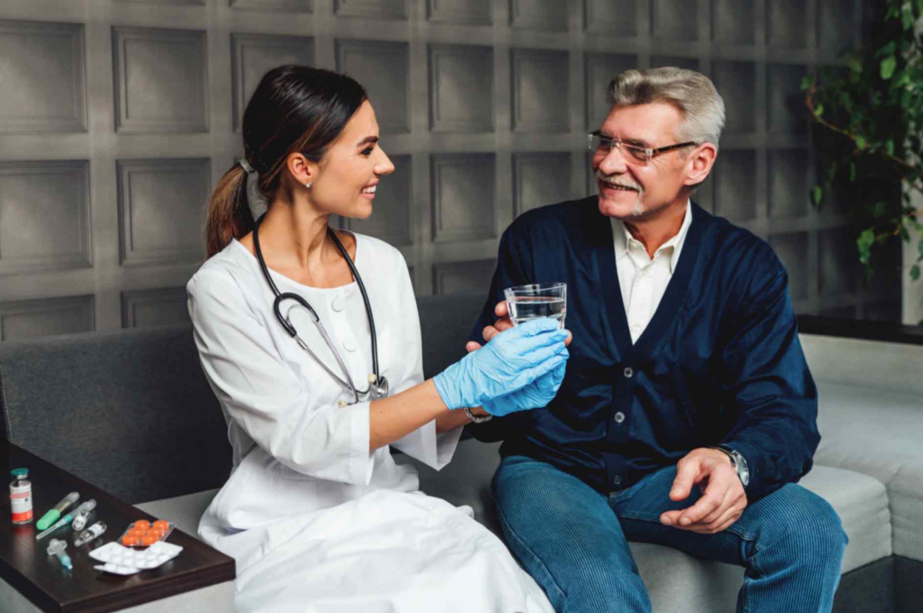 Female Doctor Taking Care of Old Patient