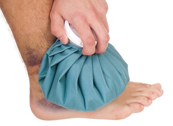 A man is icing his foot...