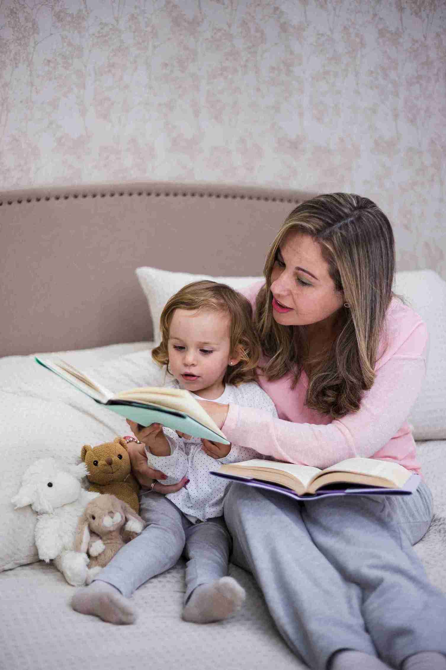 Mother Reading Bedtime Book to Kid