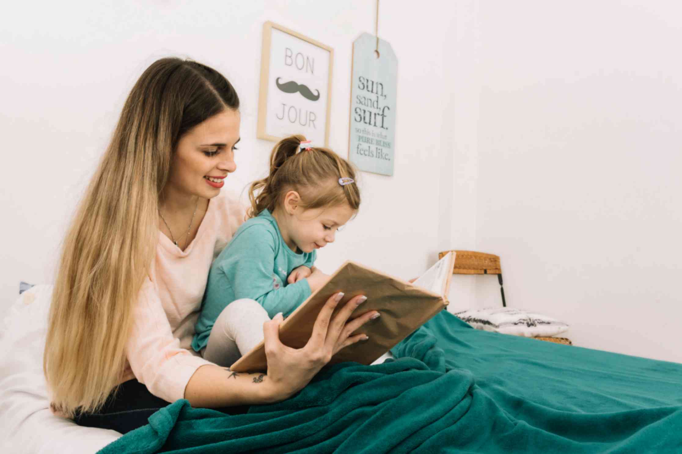 Mother and Daughter Reading Bedtime Book