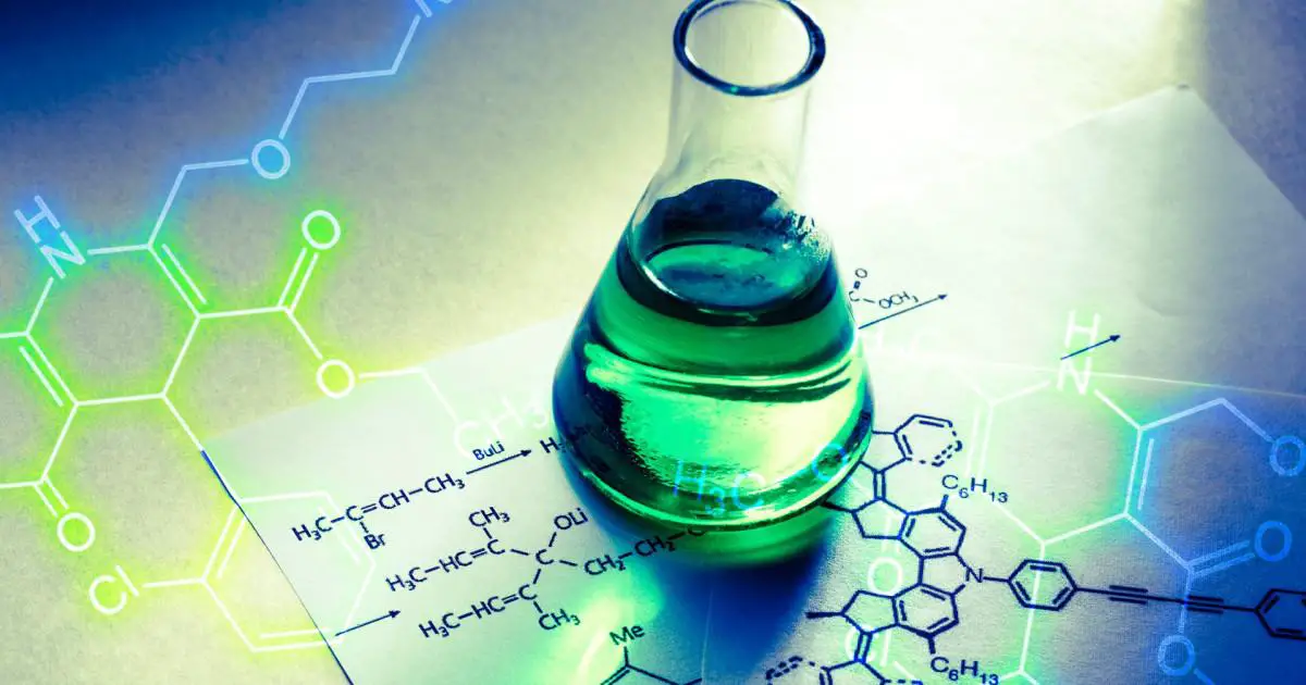 A flask containing green liquid, positioned over a backdrop of intricate chemical formulas, 