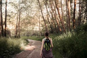 Woman Walking Alone in the Forest
