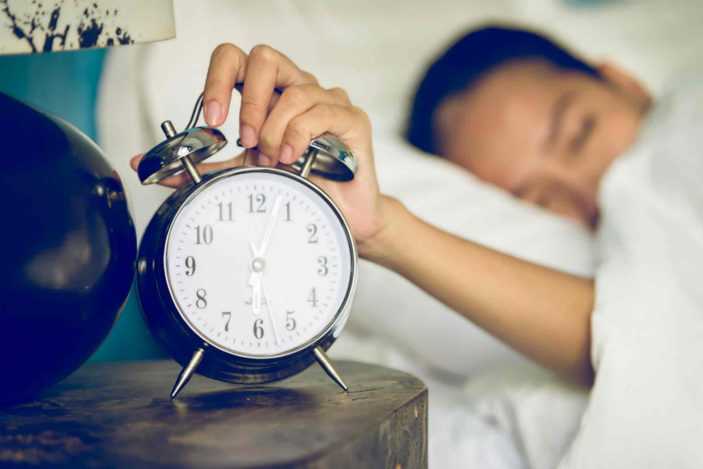 Women Shutting Off the Alarm