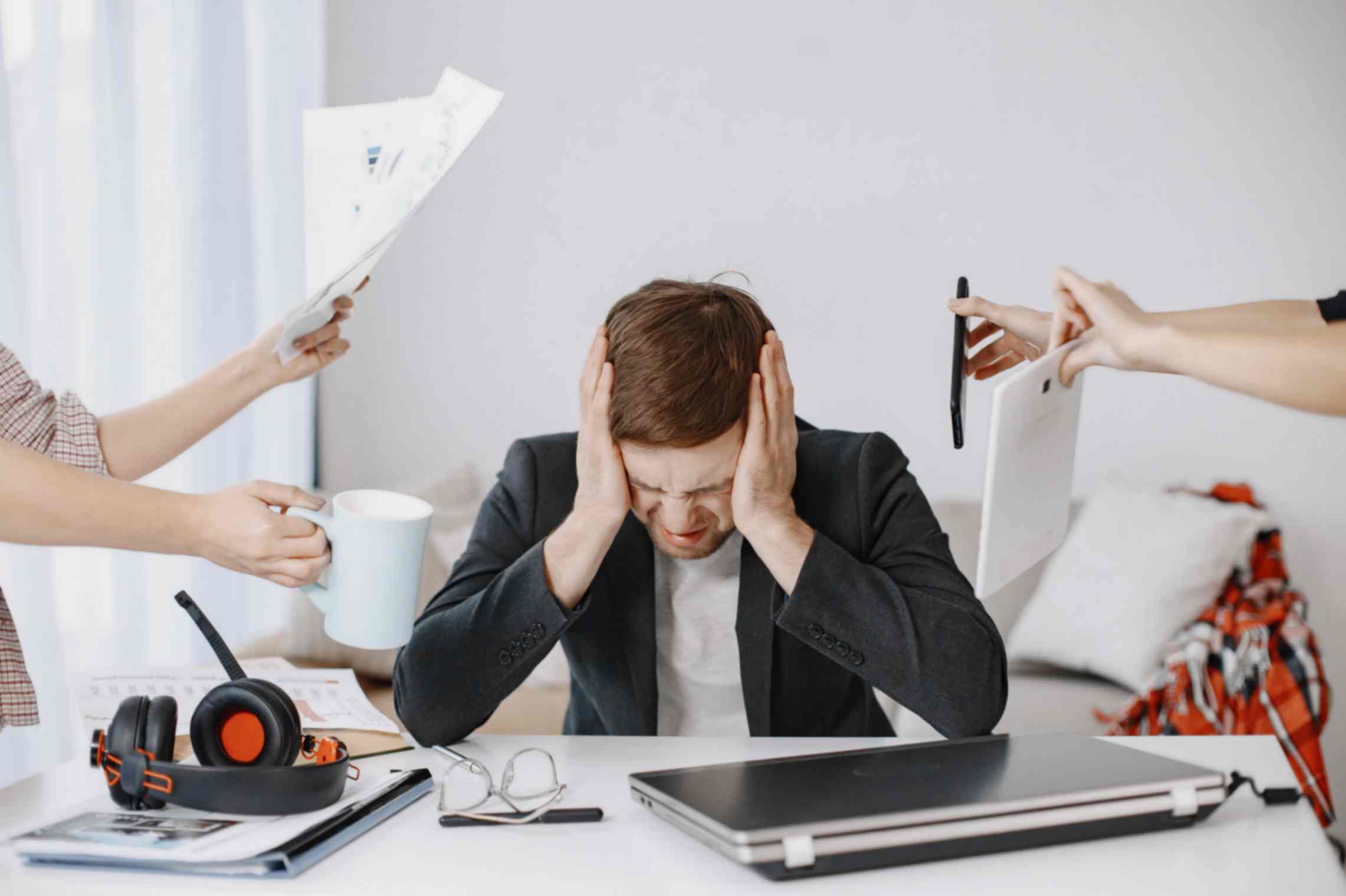 Young Man is Feeling Tired from Work Stress