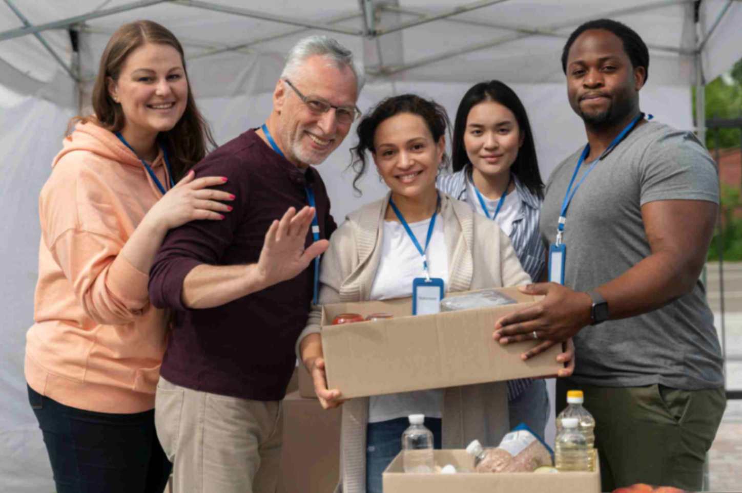 group of people volunteering for foodbank setup for poor people