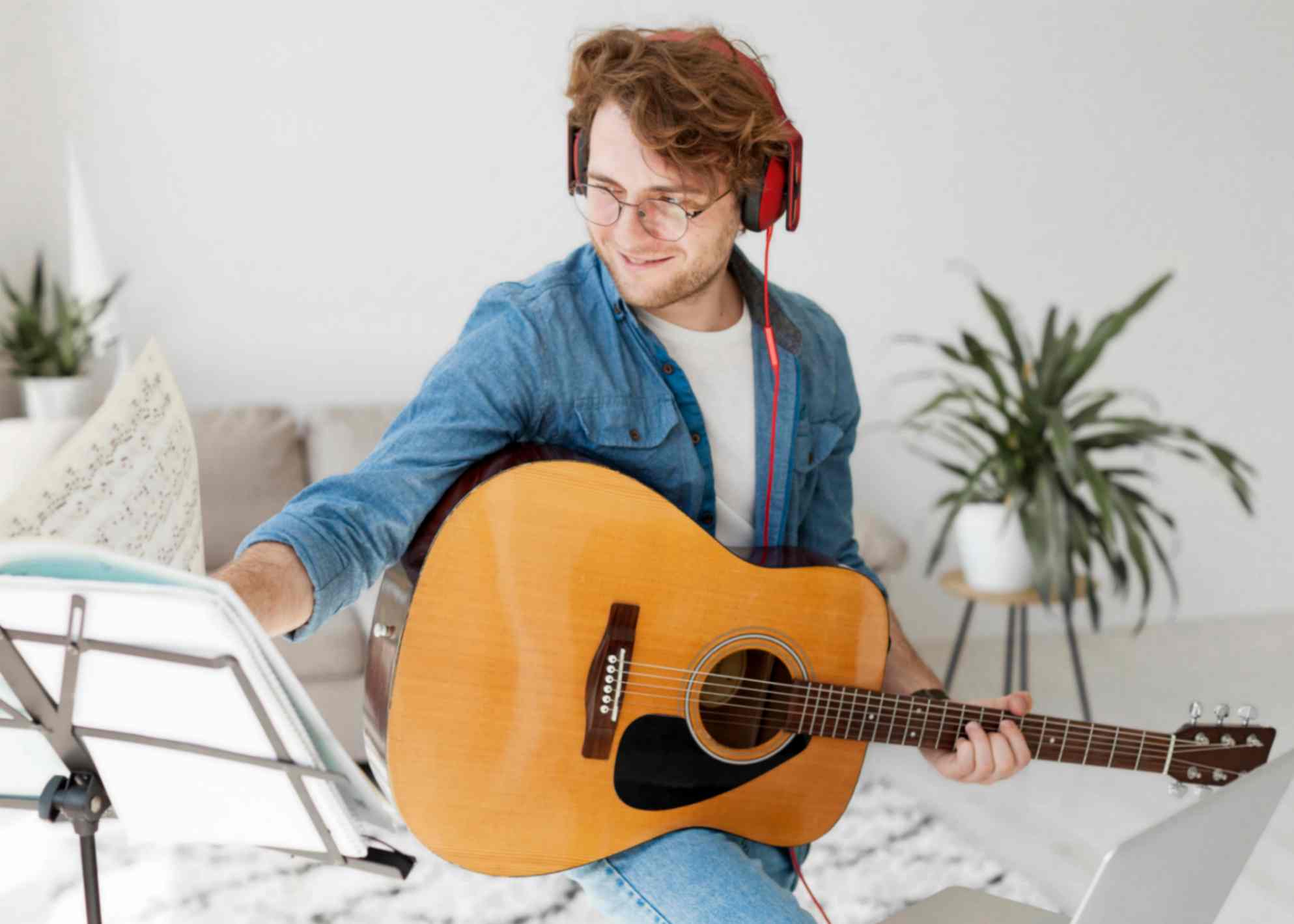 teen is playing guitar